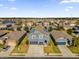 Two-story house with solar panels, neighborhood view, and a two-car garage at 4538 Cortland Dr, Davenport, FL 33837