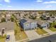 Two-story house with solar panels, neighborhood view, and a two-car garage at 4538 Cortland Dr, Davenport, FL 33837