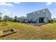 Spacious backyard with patio, seating area, and garden at 4538 Cortland Dr, Davenport, FL 33837