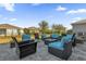 Relaxing backyard patio with fire pit and seating area at 4538 Cortland Dr, Davenport, FL 33837