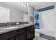 Clean bathroom with double sinks, granite countertop, and tub shower at 4538 Cortland Dr, Davenport, FL 33837