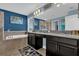 Elegant bathroom with double vanity, soaking tub, and dark wood cabinets at 4538 Cortland Dr, Davenport, FL 33837