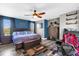 Spacious bedroom with king-size bed, ceiling fan, and wood flooring at 4538 Cortland Dr, Davenport, FL 33837