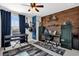 Bedroom with wood wall, desk, musical instruments, and ample storage at 4538 Cortland Dr, Davenport, FL 33837