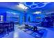 Game room with pool table, bar area, and vibrant blue LED lighting at 4538 Cortland Dr, Davenport, FL 33837