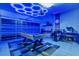 Game room with pool table, bar area, and vibrant blue LED lighting at 4538 Cortland Dr, Davenport, FL 33837