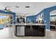 Modern kitchen with a large island, granite countertops, and stainless steel appliances at 4538 Cortland Dr, Davenport, FL 33837
