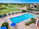 Community lap pool with plenty of lounge chairs at 4538 Cortland Dr, Davenport, FL 33837
