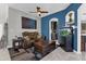 Relaxing living room with a leather recliner, coffee table, and ocean-themed art at 4538 Cortland Dr, Davenport, FL 33837