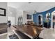 Open living area with a rustic table, couch and large fish tank at 4538 Cortland Dr, Davenport, FL 33837