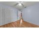 Light blue bedroom with wood floors and built-in closet at 4689 Carmel St, Orlando, FL 32808