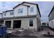 Two-story house under construction with two-car garage, block exterior, and landscaping at 5106 Rain Shadow Dr, Saint Cloud, FL 34772