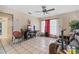 Bright living room featuring tile floors and a ceiling fan at 5300 Hondo Way, Orlando, FL 32810