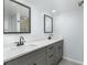 Double vanity bathroom with gray cabinets and quartz countertop at 5341 Bamboo Ct # 418, Orlando, FL 32811