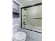 Clean bathroom with tub shower combo and gray tile at 5341 Bamboo Ct # 418, Orlando, FL 32811