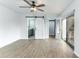 Main bedroom with ceiling fan and sliding door to balcony at 5341 Bamboo Ct # 418, Orlando, FL 32811