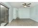 Bedroom with ceiling fan and door to hallway at 5341 Bamboo Ct # 418, Orlando, FL 32811