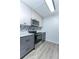 Modern kitchen with stainless steel appliances and gray cabinets at 5341 Bamboo Ct # 418, Orlando, FL 32811