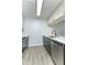 Updated kitchen with gray cabinets and stainless steel appliances at 5341 Bamboo Ct # 418, Orlando, FL 32811