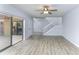Spacious living room with laminate flooring and access to patio at 5341 Bamboo Ct # 418, Orlando, FL 32811