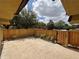 Serene patio with private wooden fence offers seclusion, landscaping, and space for outdoor enjoyment at 5341 Bamboo Ct # 418, Orlando, FL 32811