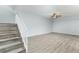 Modern stairs with white railings and laminate flooring at 5341 Bamboo Ct # 418, Orlando, FL 32811