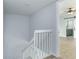 White railing stairs leading to upper level at 5341 Bamboo Ct # 418, Orlando, FL 32811