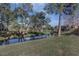 Peaceful waterfront view with lush landscaping at 5341 Bamboo Ct # 418, Orlando, FL 32811