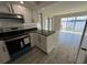 Kitchen with water views and stainless steel appliances at 624 Desoto Dr, Casselberry, FL 32707