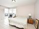 Bedroom with a bed, nightstand, and tiled floor at 669 Grenadine Ct # S, Winter Park, FL 32792