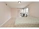 Bedroom with a bed, chair, and access to a patio at 669 Grenadine Ct # S, Winter Park, FL 32792