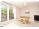 Bright dining area with a round table and chairs near windows at 669 Grenadine Ct # S, Winter Park, FL 32792