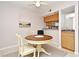 Small kitchenette with wood cabinets and a small sink at 669 Grenadine Ct # S, Winter Park, FL 32792