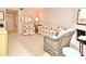 Living room with floral print furniture and a fireplace at 669 Grenadine Ct # S, Winter Park, FL 32792