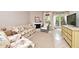 Living room with floral sofas, wicker chairs, and a fireplace at 669 Grenadine Ct # S, Winter Park, FL 32792