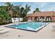 Community pool with lounge chairs for relaxation at 669 Grenadine Ct # S, Winter Park, FL 32792