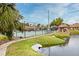 Community tennis court near a pond and gazebo at 669 Grenadine Ct # S, Winter Park, FL 32792