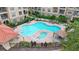 Community pool and spa viewed from above; two buildings visible at 914 Charo Pkwy # 113, Davenport, FL 33897