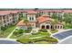 Aerial view of Bella Piazza community, highlighting clubhouse and landscaping at 914 Charo Pkwy # 113, Davenport, FL 33897