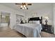 King bedroom with access to bathroom and mirrored closet doors at 914 Charo Pkwy # 113, Davenport, FL 33897