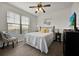 Guest bedroom with full bed, window, and ceiling fan at 914 Charo Pkwy # 113, Davenport, FL 33897