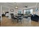Elegant dining room with table and chairs, adjacent to living room at 914 Charo Pkwy # 113, Davenport, FL 33897