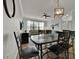 Dining area with a six-chair table and modern lighting at 914 Charo Pkwy # 113, Davenport, FL 33897