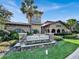 Bella Piazza entrance sign with landscaping, showcasing the community's name at 914 Charo Pkwy # 113, Davenport, FL 33897