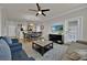 Open living room with dining and kitchen view at 914 Charo Pkwy # 113, Davenport, FL 33897