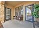 Spacious patio with two chairs and access to the building at 914 Charo Pkwy # 113, Davenport, FL 33897