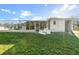 Large backyard with unfinished structure needing work at 9405 Holbrook Dr, Orlando, FL 32817