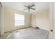 Under-construction bedroom with new flooring and window at 9405 Holbrook Dr, Orlando, FL 32817