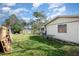 Large backyard with grassy area and wooden fence at 1 Black Jack Cir, Port Orange, FL 32128