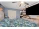 Bedroom with large bed, TV, and closet at 1 Black Jack Cir, Port Orange, FL 32128